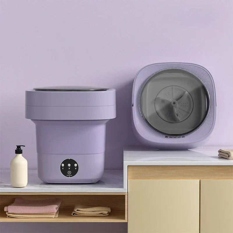 "Hopfällbar portabel tvättmaskin med kompakt design, 6L kapacitet, vit och blå detaljer för effektiv tvätt."
