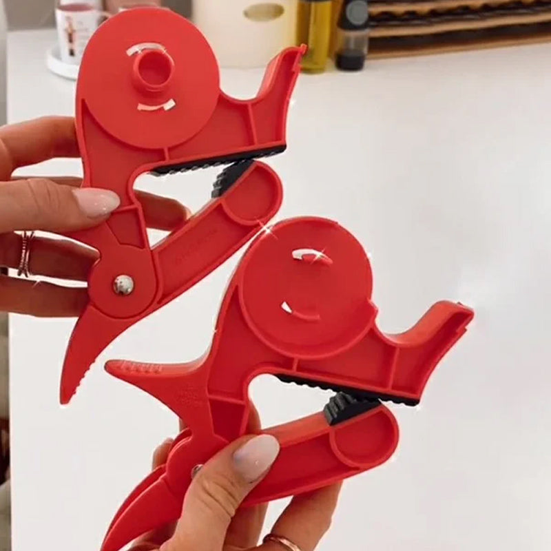 "Inslagningverktyg i röd och grå plast för presentinpackning, justerbar för olika pappersstorlekar."