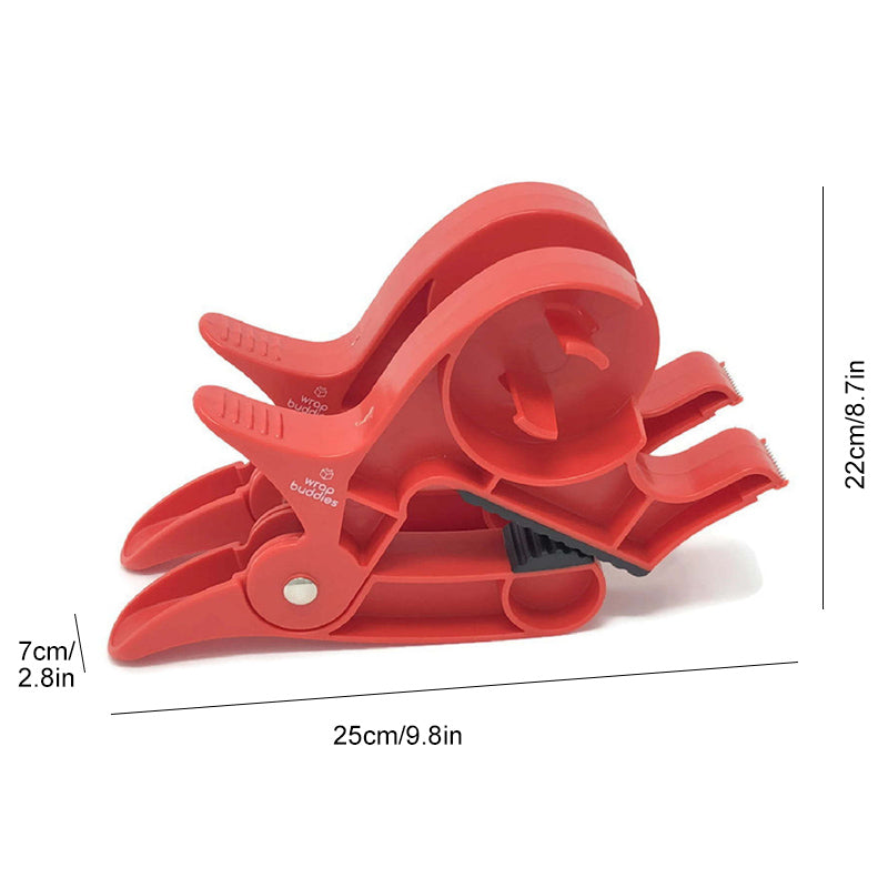 "Inslagningverktyg i röd och grå plast för presentinpackning, justerbar för olika pappersstorlekar."