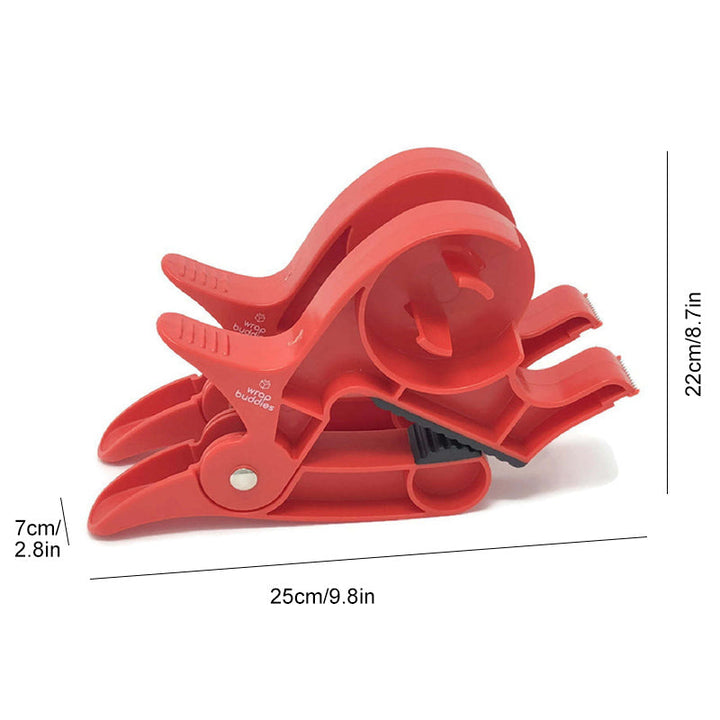 "Inslagningverktyg i röd och grå plast för presentinpackning, justerbar för olika pappersstorlekar."