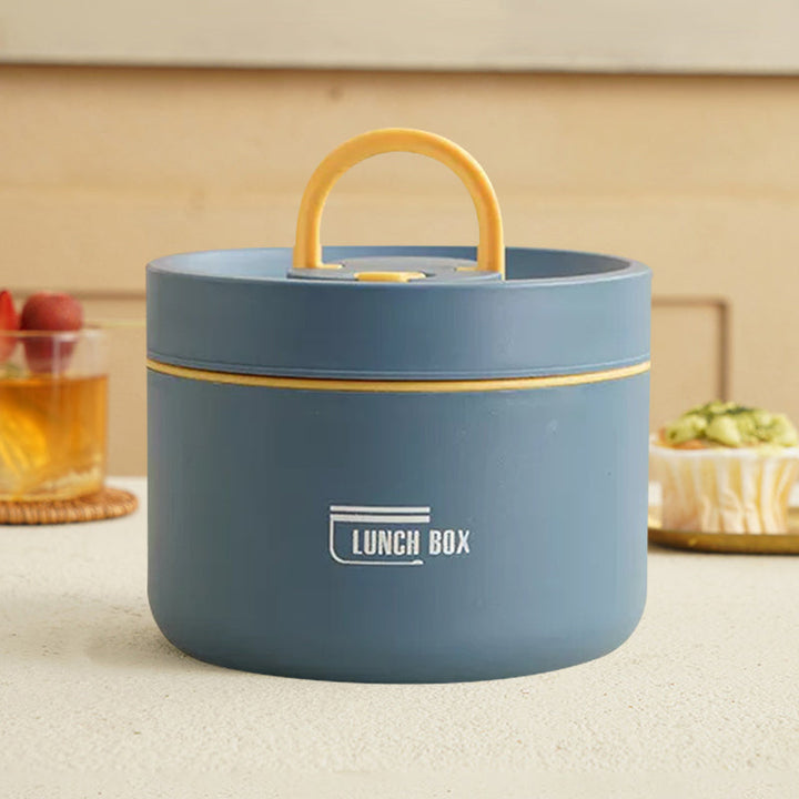 "Isolerad bärbar lunchlåda i blått, brun och beige. Vakuumisolerad för värme och läckagesäker design för mat på språng."
