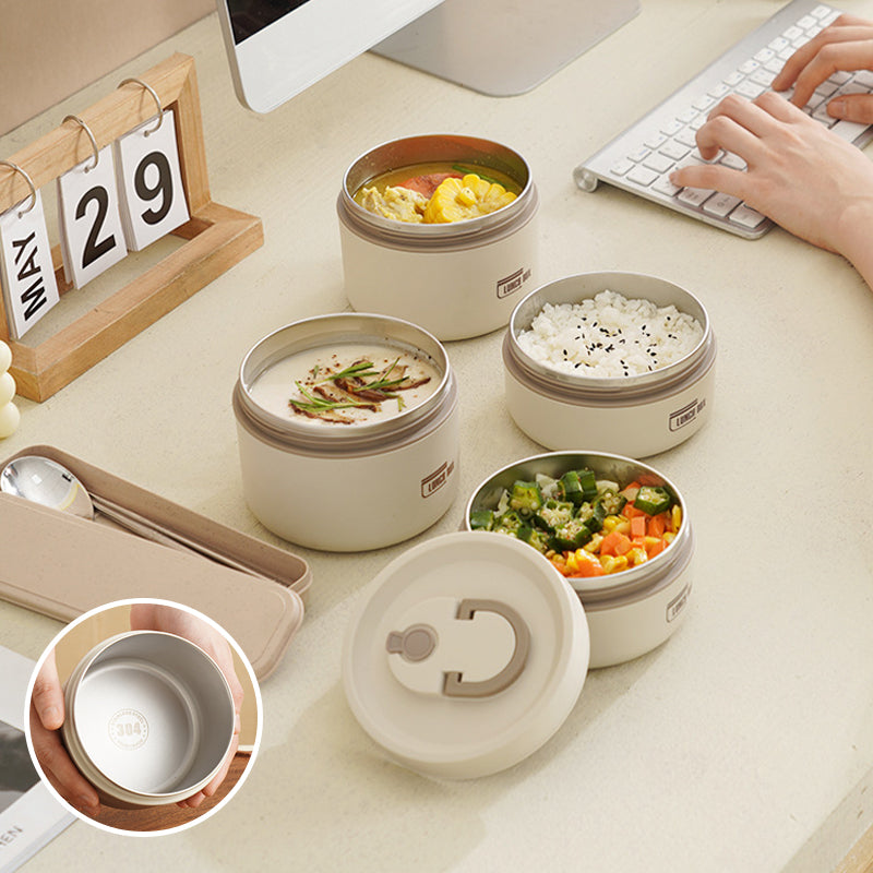 "Isolerad bärbar lunchlåda i blått, brun och beige. Vakuumisolerad för värme och läckagesäker design för mat på språng."