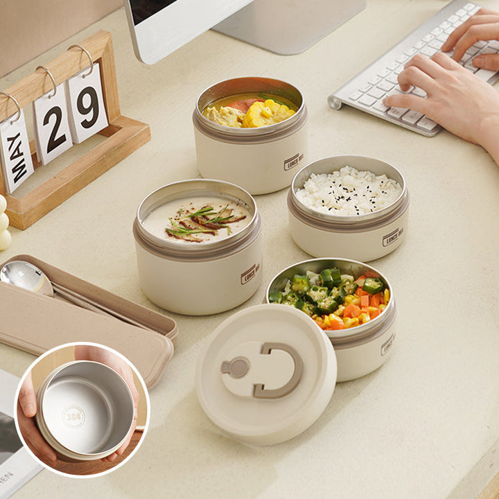"Isolerad bärbar lunchlåda i blått, brun och beige. Vakuumisolerad för värme och läckagesäker design för mat på språng."