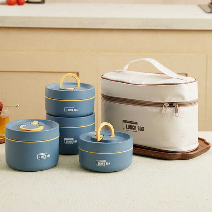 "Isolerad bärbar lunchlåda i blått, brun och beige. Vakuumisolerad för värme och läckagesäker design för mat på språng."