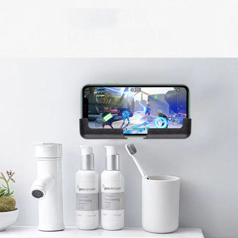 Justerbar biltelefonhållare för instrumentbräda i svart/glad färg, självhäftande bas, hållbar och stötsäker design.