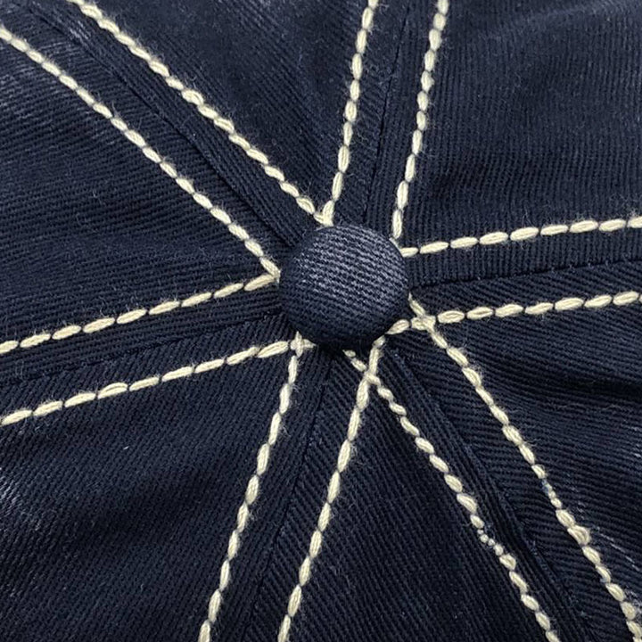 "Justerbar unisex baseballkeps i bomull med broderade detaljer, i flera färger, kupolformad med kort brätte."