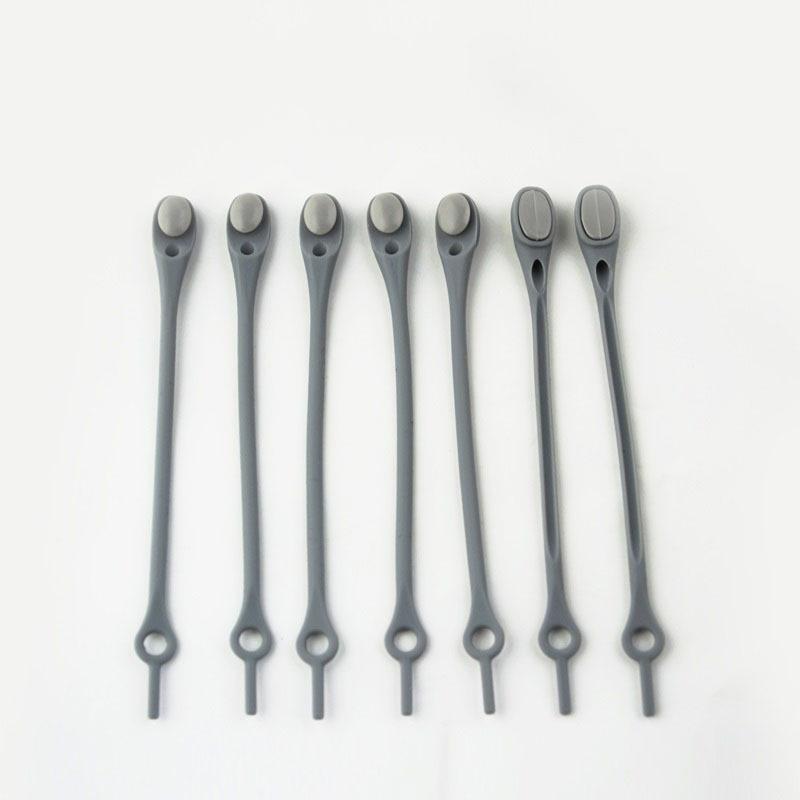 "Knytfria silikon skosnören i färgglada nyanser, elastiska och vattentäta, för unisex skor med öljetter."