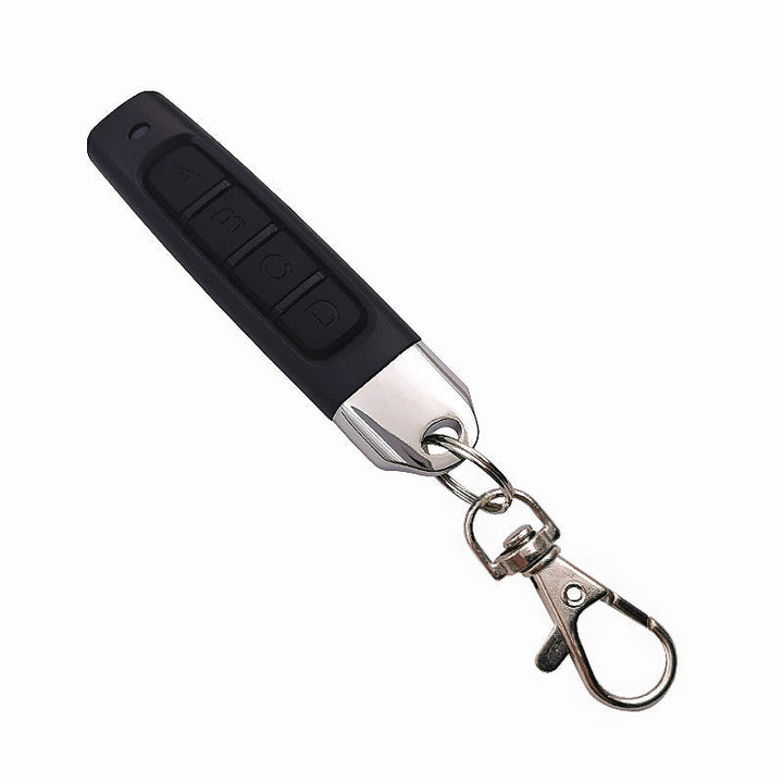 "Kompakt 4-i-1 fjärrkontrollduplikator med enkel design, effektivt kloningsverktyg för organisering av fjärrkontroller."