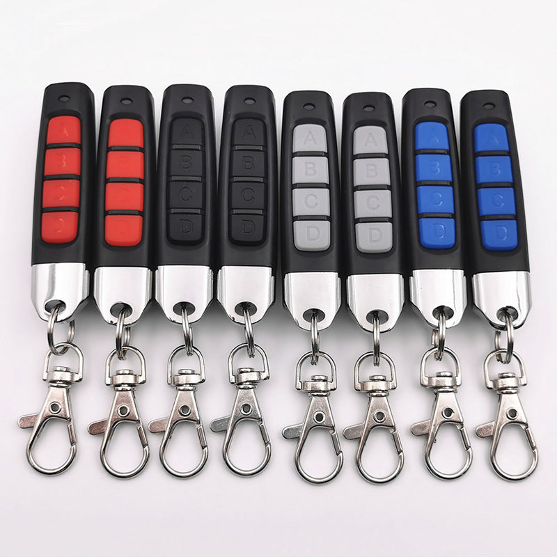 "Kompakt 4-i-1 fjärrkontrollduplikator med enkel design, effektivt kloningsverktyg för organisering av fjärrkontroller."