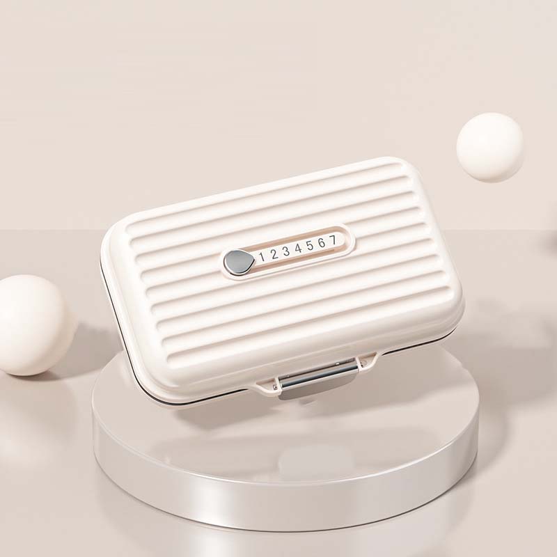 "Kompakt pillerburk med sju fack, rosa nyans, idealisk för moderna kvinnor, skyddar medicin mot fukt och damm."