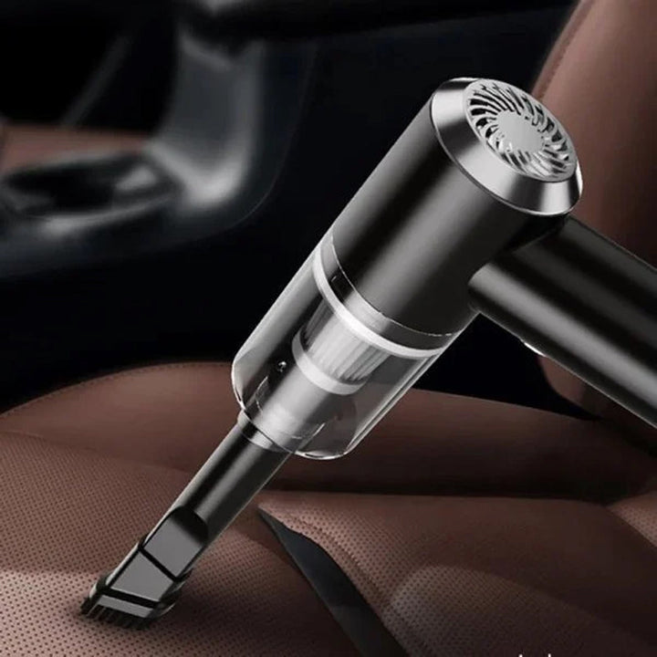 "Kompakt trådlös handhållen bildammsugare i svart för hem och bil, med kraftfull sugkapacitet och enkel hantering."