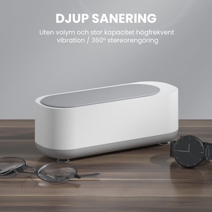 "Kompakt vit och grå ultraljudsrengöringsmaskin, idealisk för smycken och glasögon, bärbar och effektiv rengöring."