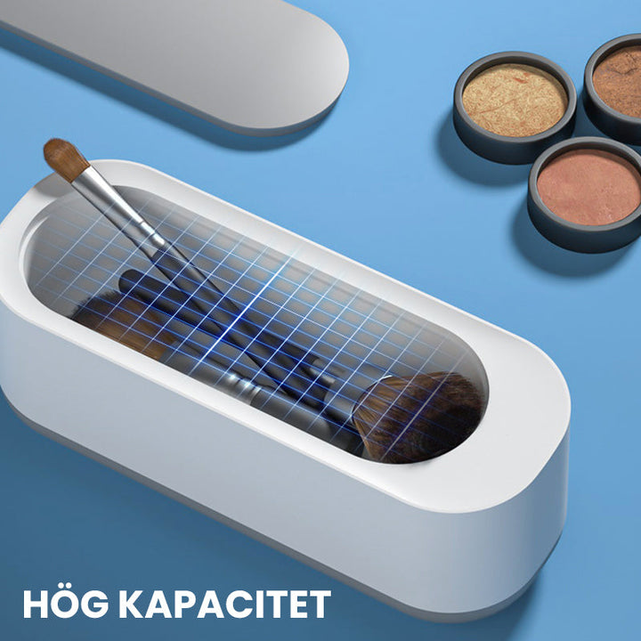 "Kompakt vit och grå ultraljudsrengöringsmaskin, idealisk för smycken och glasögon, bärbar och effektiv rengöring."