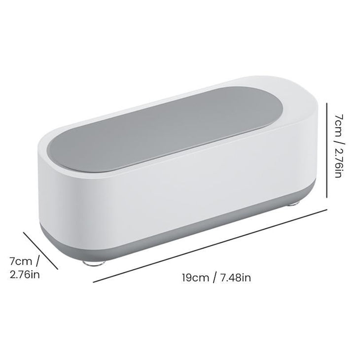 "Kompakt vit och grå ultraljudsrengöringsmaskin, idealisk för smycken och glasögon, bärbar och effektiv rengöring."