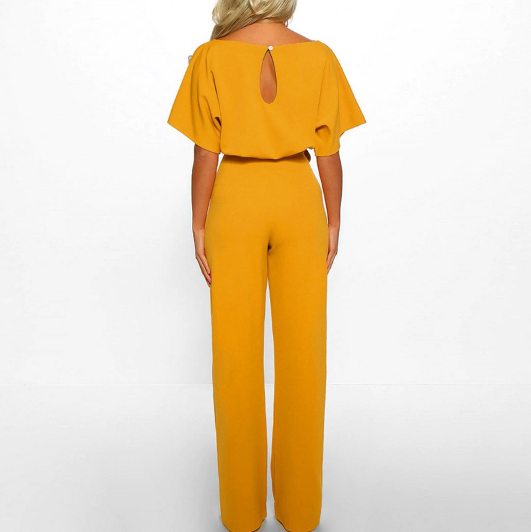 Kortärmad dams jumpsuit med vida ben och justerbart midjeband i olika färger, perfekt för alla tillfällen.