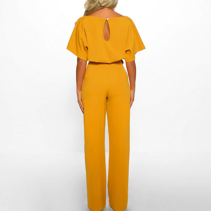 Kortärmad dams jumpsuit med vida ben och justerbart midjeband i olika färger, perfekt för alla tillfällen.
