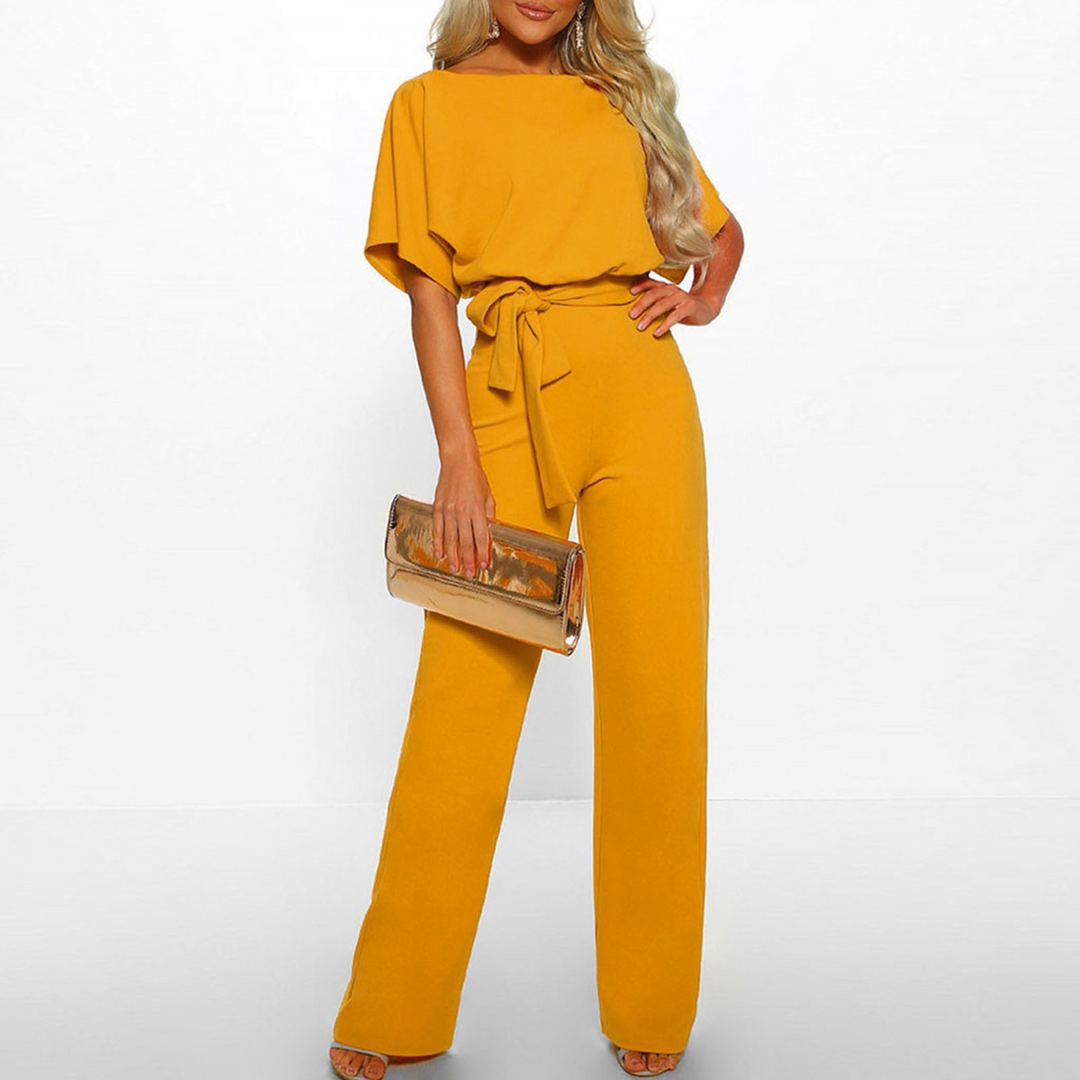 Kortärmad dams jumpsuit med vida ben och justerbart midjeband i olika färger, perfekt för alla tillfällen.