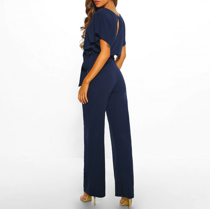 Kortärmad dams jumpsuit med vida ben och justerbart midjeband i olika färger, perfekt för alla tillfällen.