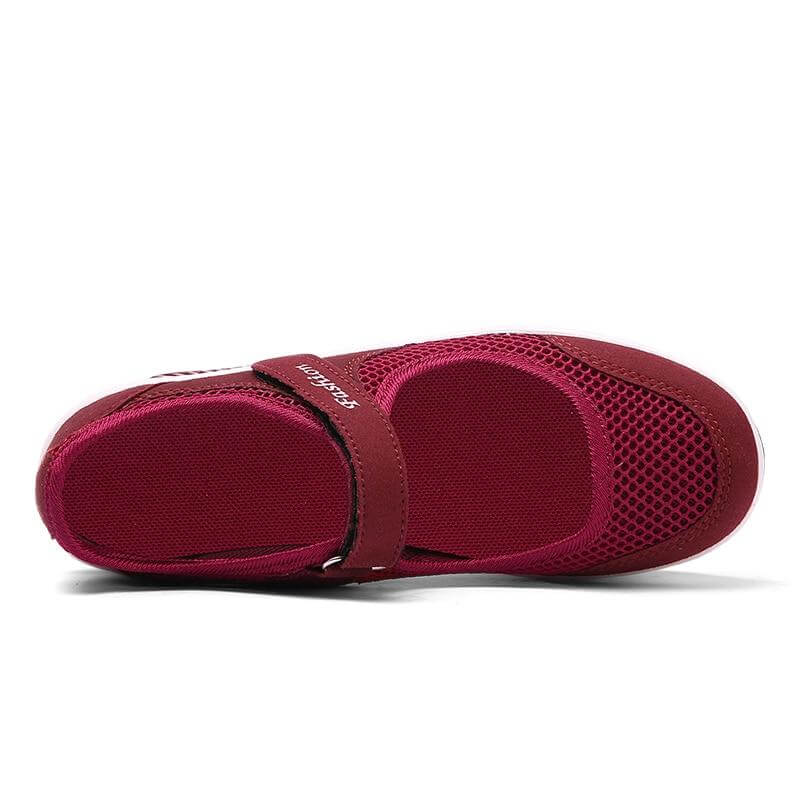 Detalj av ortopediska damsneakers, halkfri sula och dämpning, blå