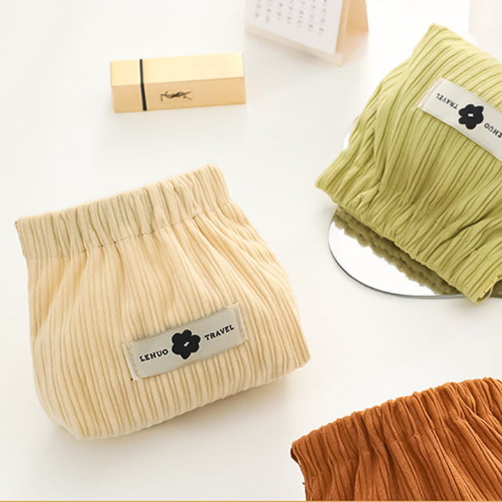 "Kvinnors corduroy hårsnodd organisatör, mjuk material, multifunktionell design, stilren blå nyans, kompakt storlek."