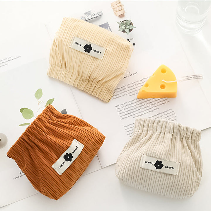 "Kvinnors corduroy hårsnodd organisatör, mjuk material, multifunktionell design, stilren blå nyans, kompakt storlek."