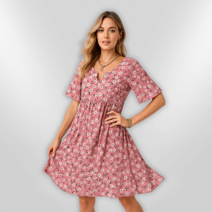 "Kvinnors sommarklänning i blommönster, lätt material, S-XL. Perfekt för varma dagar."