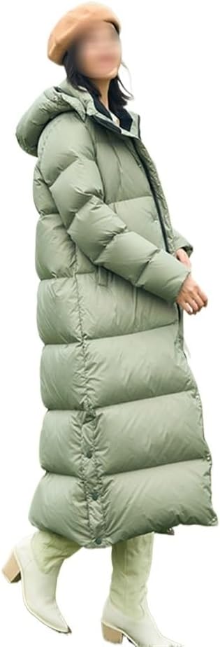 "Lång quiltad dunkappa dam med huva, oversized passform, varm vaddering, perfekt för vinterdagar och stilriktig komfort."