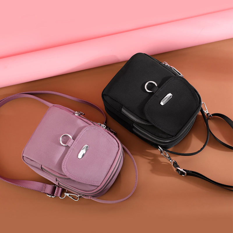 "Lätt vattentät unisex crossbody-väska i nylon med flera fickor, justerbar axelrem, kompakt och funktionell design"