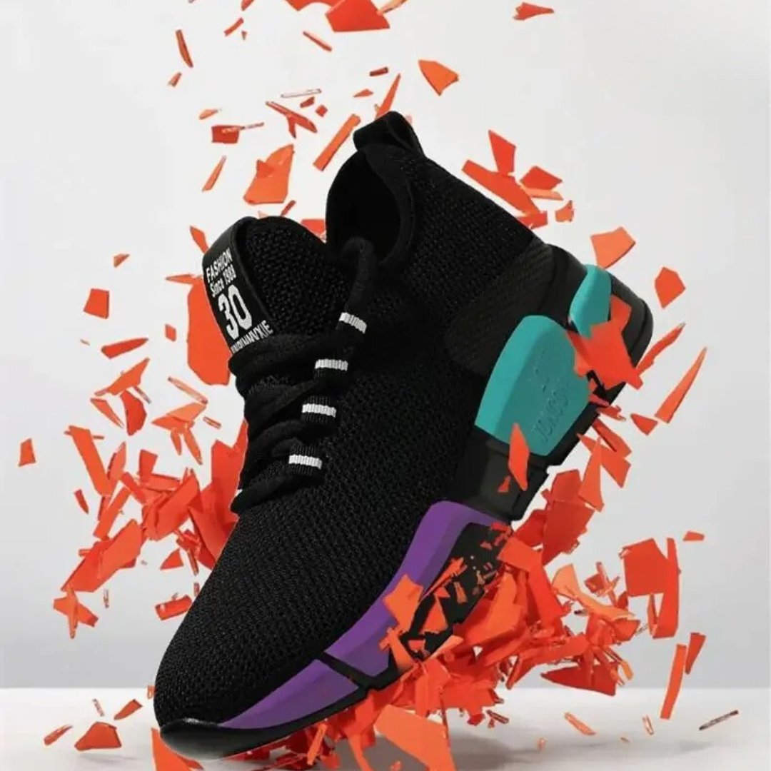 "Lättviktiga damsneakers i lila, rött, svart och vitt med andningsbart meshmaterial och flexibel, halkfri sula."