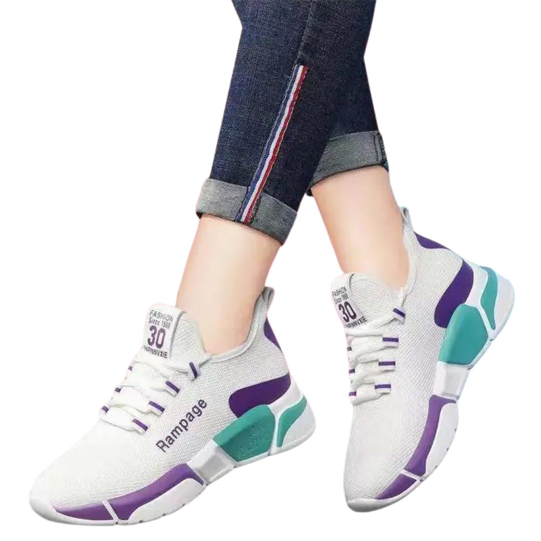 "Lättviktiga damsneakers i lila, rött, svart och vitt med andningsbart meshmaterial och flexibel, halkfri sula."