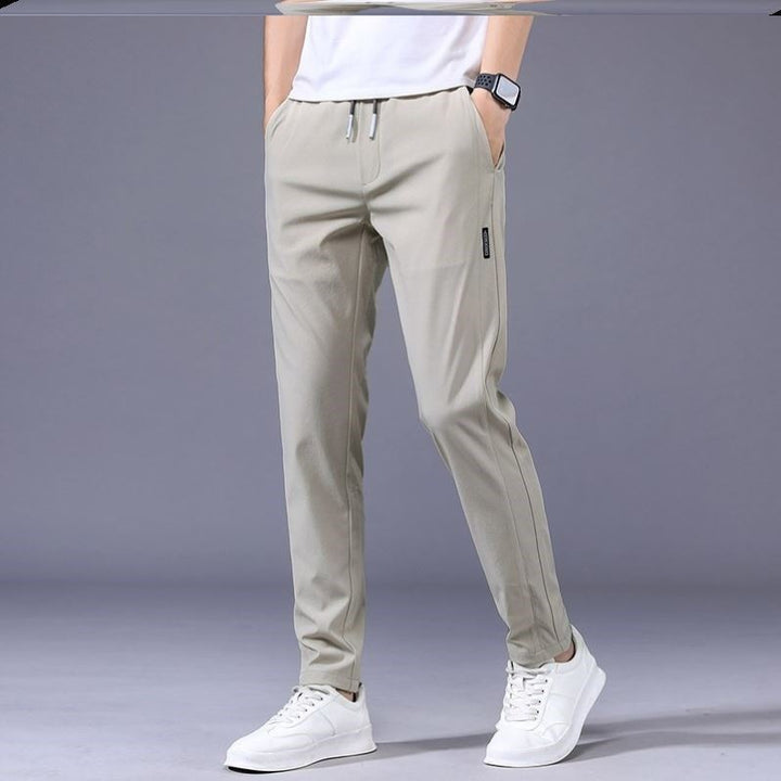 "Lösa rak sweatpants för män i koreansk stil, avslappnad passform, flerfärgade alternativ, idealiska för stil och komfort."