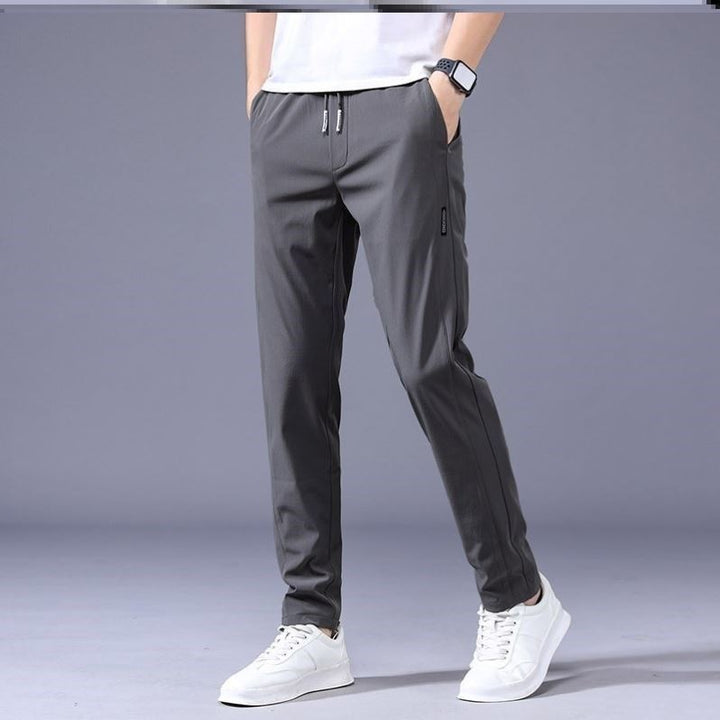 "Lösa rak sweatpants för män i koreansk stil, avslappnad passform, flerfärgade alternativ, idealiska för stil och komfort."