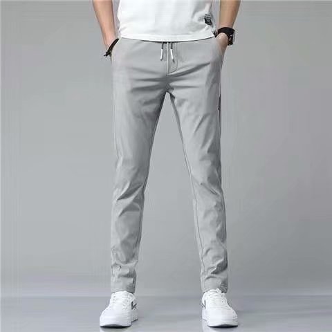"Lösa rak sweatpants för män i koreansk stil, avslappnad passform, flerfärgade alternativ, idealiska för stil och komfort."