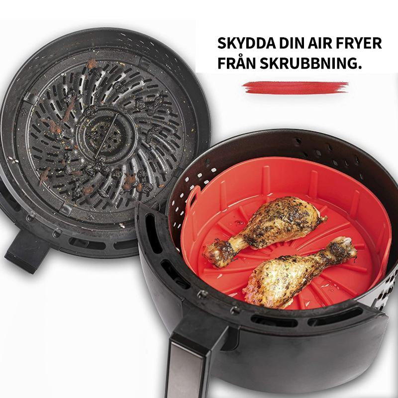 "Luftfritös-bricka i röd/grå silikon, non-stick yta, liten/stor, för jämn tillagning och renare fritös."