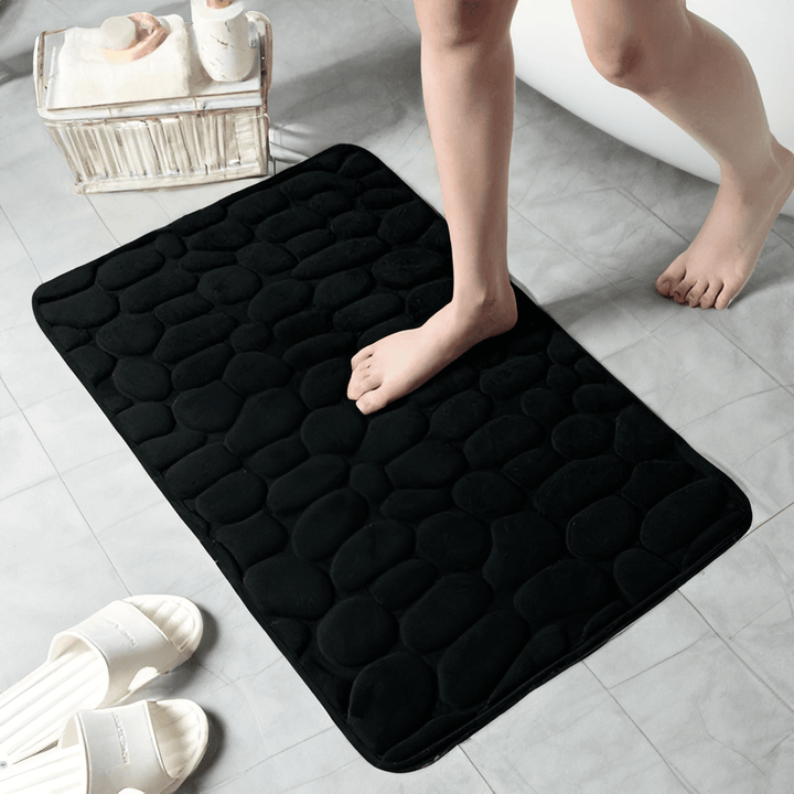 "Lyxig halkfri badmatta, brun, 40x60 cm, flanell och memory foam, säker och stilren, i elegant badrumsmiljö."