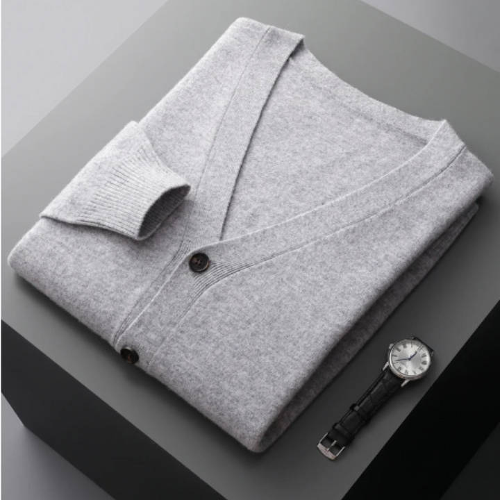 "Lyxig kaschmirkofta i elegant design, beige färg med klassisk knappknäppning, perfekt för stil och komfort."