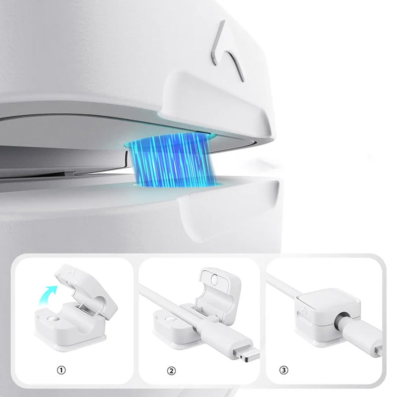 "Magnetisk kabelhållare håller kablar organiserade, stilren design i svart och vit, passar kablar upp till 7 mm."