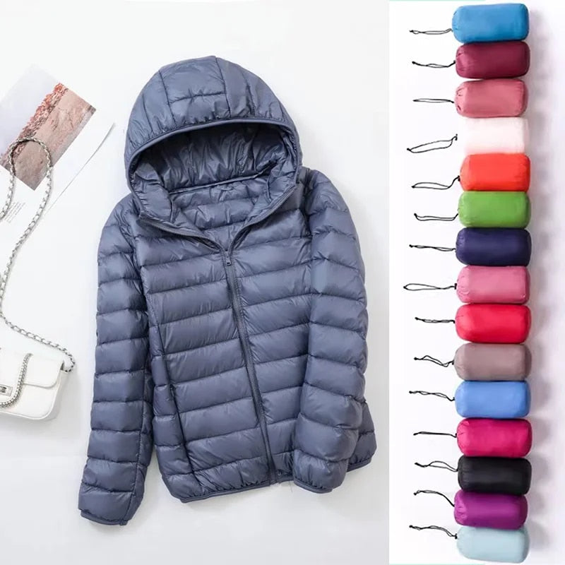 "Mångsidig och vattentät dubbelstilad dam-puffjacka, elegant grå design med dragkedja, perfekt för vinter."
