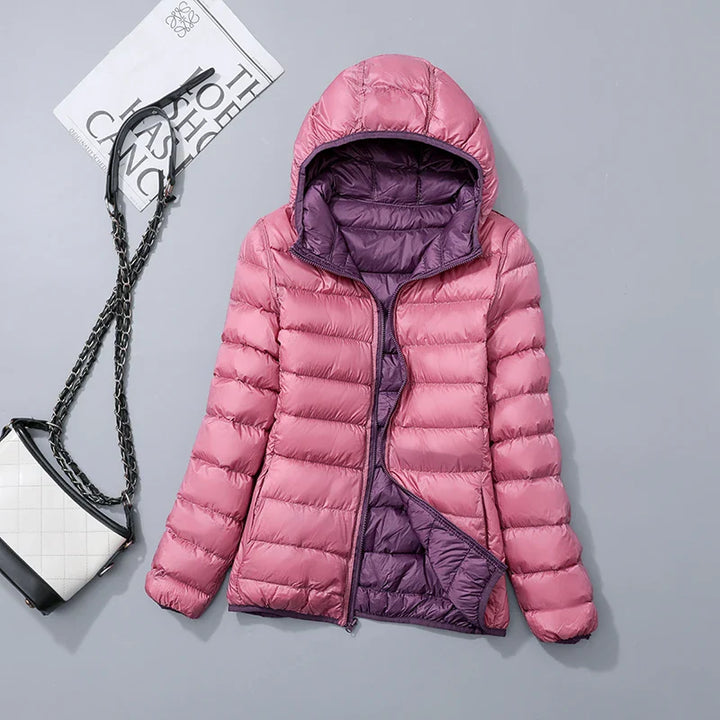 "Mångsidig och vattentät dubbelstilad dam-puffjacka, elegant grå design med dragkedja, perfekt för vinter."