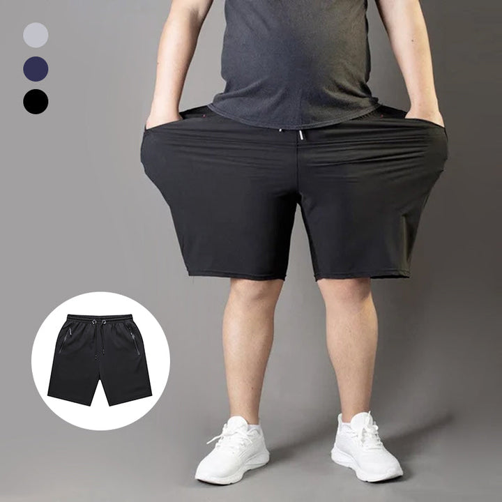 "Mäns snabbtorkande lätta träningsshorts i svart, grå och mörkblå. Elastisk midjeband och säker dragkedjeficka."