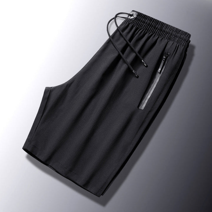 "Mäns snabbtorkande lätta träningsshorts i svart, grå och mörkblå. Elastisk midjeband och säker dragkedjeficka."