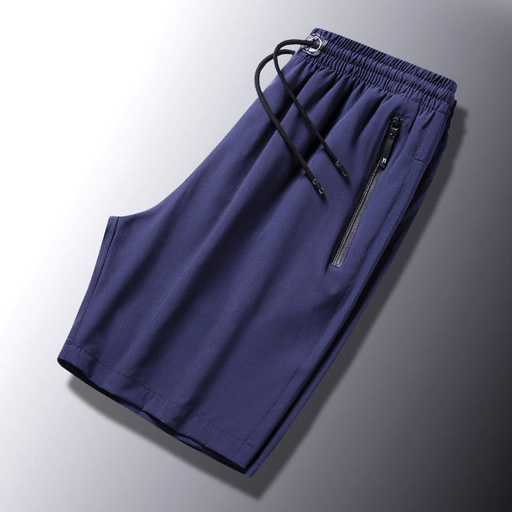 "Mäns snabbtorkande lätta träningsshorts i svart, grå och mörkblå. Elastisk midjeband och säker dragkedjeficka."