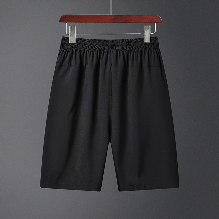 "Mäns snabbtorkande lätta träningsshorts i svart, grå och mörkblå. Elastisk midjeband och säker dragkedjeficka."