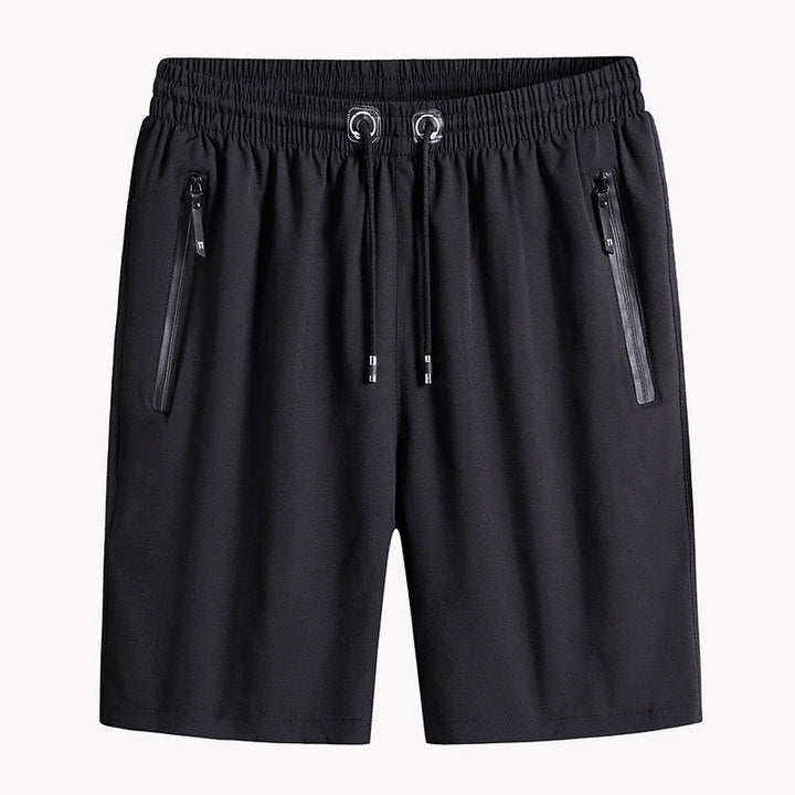 "Mäns snabbtorkande lätta träningsshorts i svart, grå och mörkblå. Elastisk midjeband och säker dragkedjeficka."