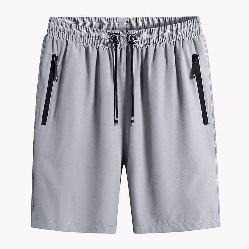 "Mäns snabbtorkande lätta träningsshorts i svart, grå och mörkblå. Elastisk midjeband och säker dragkedjeficka."