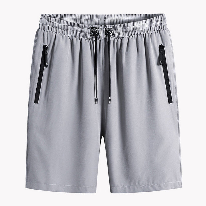 "Mäns snabbtorkande lätta träningsshorts i svart, grå och mörkblå. Elastisk midjeband och säker dragkedjeficka."