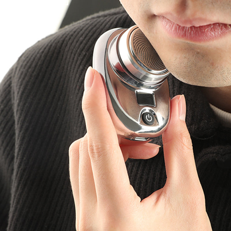 "Mini bärbar rakapparat i elegant design för män och kvinnor, kompakt och kraftig med 15 roterande blad."