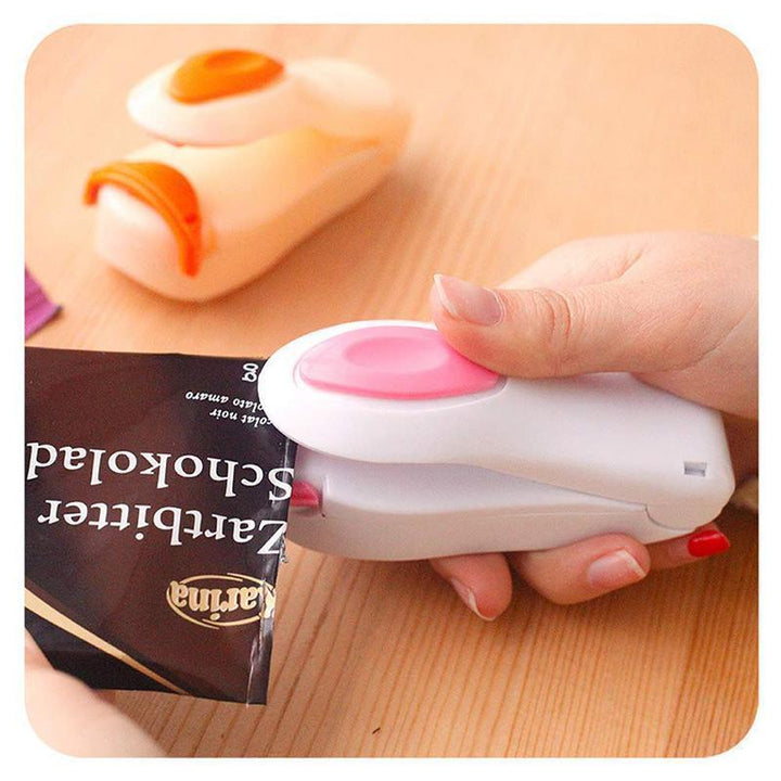 "Mini bärbar värmeförsegling för hushåll, blå, rosa, grön, gul, kompakt, magnetisk bas, matbevarande, enkel att använda."