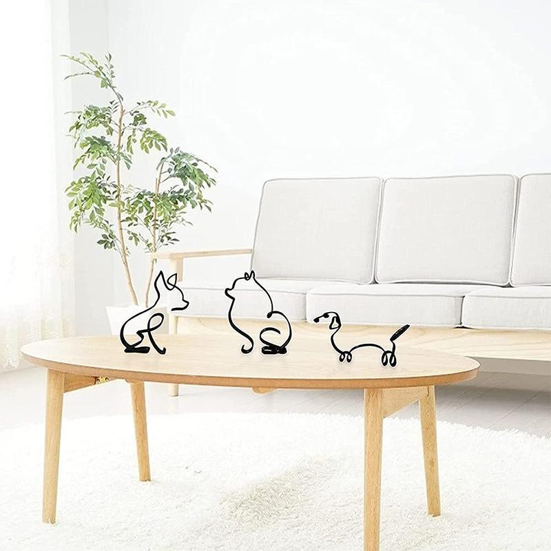 "Minimalistisk svart hunddekoration i metall som pryder väggen, perfekt för modern inredning och konstnärlig touch."