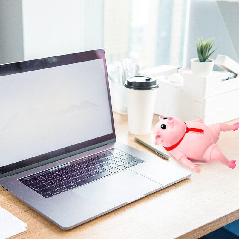 "Mjuk rosa gris leksak för avstressning, perfekt för barn och vuxna, visad i en söt pose mot ljus bakgrund."